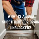 plumber-manually-unblocking-drain