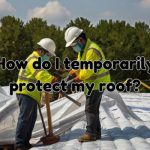workers installing temporary roof protection