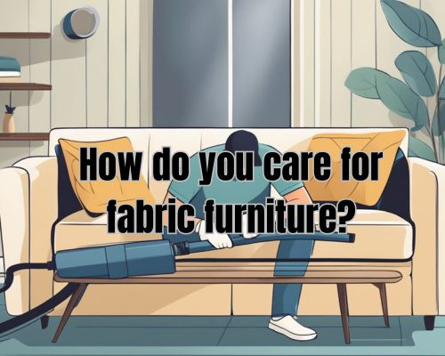 A person using a vacuum cleaner and upholstery attachment to clean a fabric sofa with gentle, circular motions