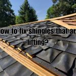a roof shingle lifting and in need of repair