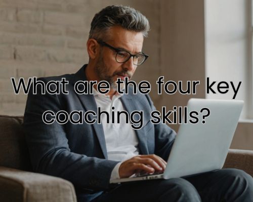 a coach reading through his laptop