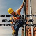 a roofer replacing gutters and downpipes