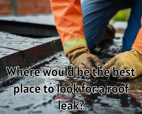 A person inspects the roof while repairing a leak